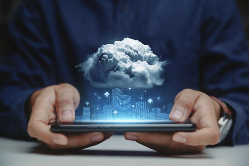 businessman holding smartphone with connect to cloud data