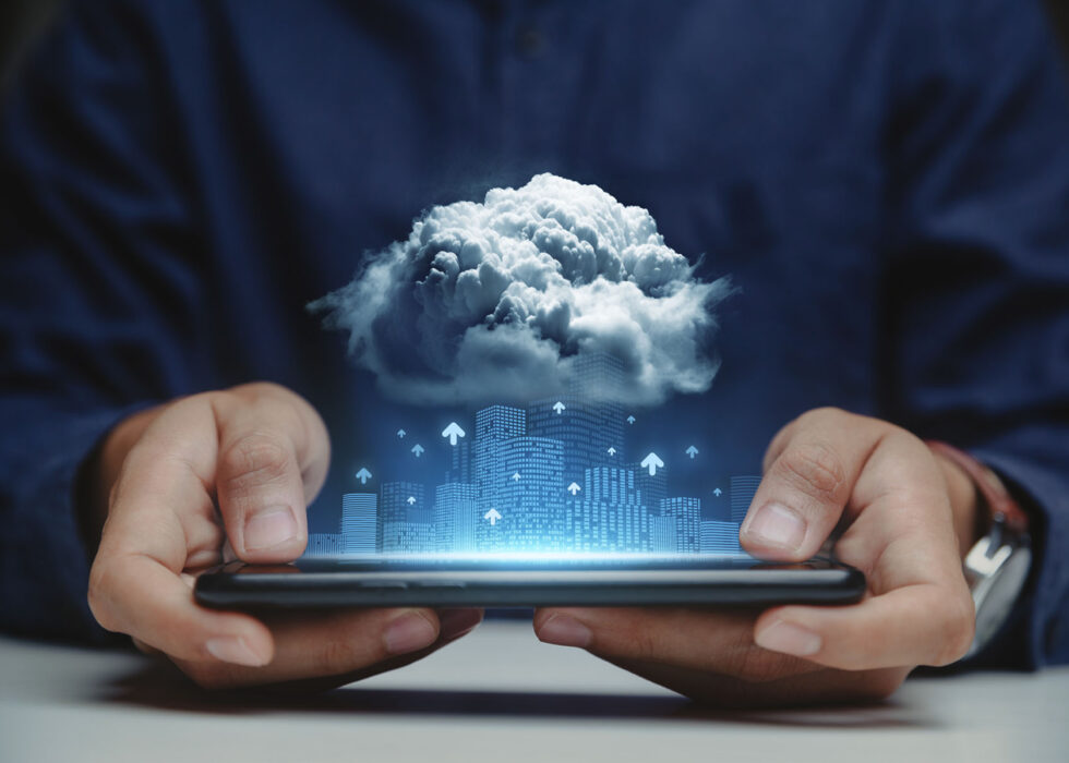 businessman holding smartphone with connect to cloud data